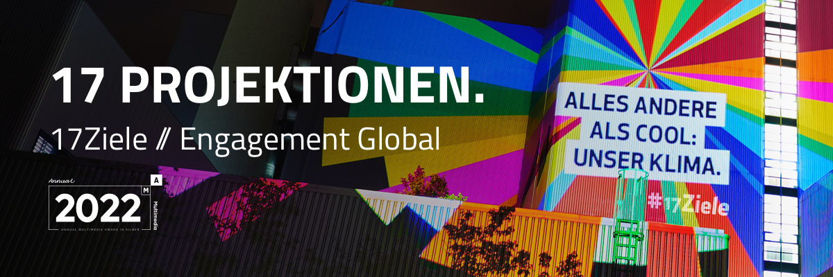 Digitaler Stunt und Social Media Kampagne mit Influencern für 17Ziele. Text, digitale Projektionen mit leuchtenden Statements zu den 17 Zielen auf symbolträchtige Gebäude und Objekte in vier Städten und vier Nächten, Verbreitung der Aktion über Social Media durch Influencer, Organisationen und eigene Kanäle, Making-of. Auszeichnung: Annual Multimedia Award Silver 2022. Bild: Lichtprojektion in Regenbogenfarben aus geometrischen Formen und Text auf eine Gebäudefassade bei Nacht.